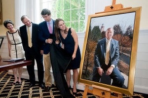 Randolph College President John E. Klein and his family see the newly- unveiled presidential portrait during a reception at Lipscomb Library.