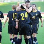 Photo of soccer team celebrating Photo of soccer team celebrating