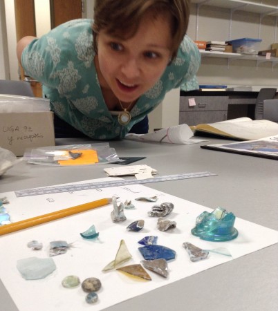 Allison-Sterrett-Krause '03, assistant professor of classics at the College of Charleston, examines specimens in her lab.