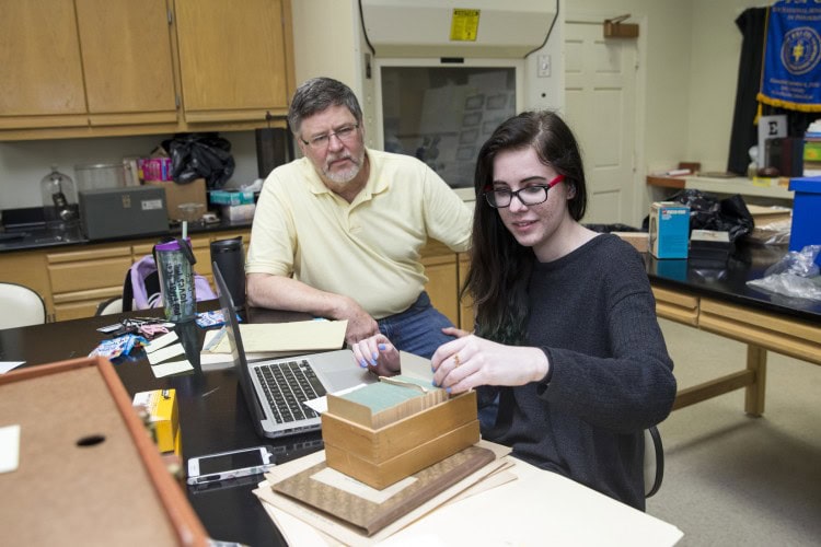 Professor of Psychology Rick Barnes and Sarah Ballard-Abbott '16 look through historic psychological tests in the College's psychology lab.