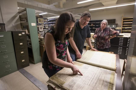 Samantha Strickler '17 and history professor Gerry Sherayko look up property records from the early 1900s in the Jones Memorial Library.