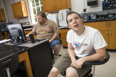 Zach Vernon ’18 (right) and Russ Burt ’16 analyze graphs of car accident statistics.