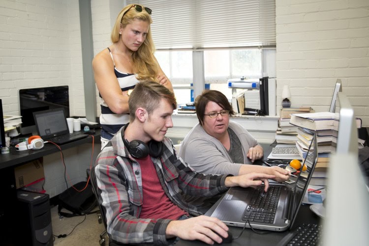 Physics Professor Katrin Schenk (right) assists Eric Huber ‘18 and Franziska Klostermyer '15 with a programming component of their project developing an ultrasonic vocalization research system.