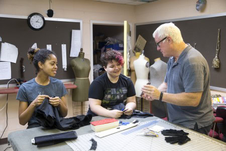 Theatre professor Ken Parks reviews photos of the stage illusion tests with students Morgan Wardlaw ’17 (left) and Daisy Howard ’17.