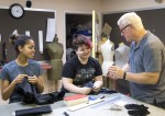 Theatre professor Ken Parks reviews photos of the stage illusion tests with students Morgan Wardlaw ’17 (left) and Daisy Howard ’17. Theatre professor Ken Parks reviews photos of the stage illusion tests with students Morgan Wardlaw ’17 (left) and Daisy Howard ’17.