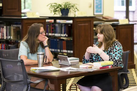 Sociology Professor Danielle Currier meets with student Ayla Hagen ’18 about her research on an old mill in the Lynchburg area.