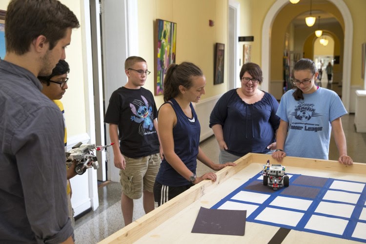 Campers built and programmed robots to play the Game of Life on a physical grid in Main Hall.