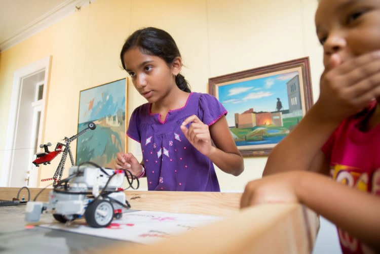 Nikitha Prabhu (left) and Shiloh Mack test their lego robot at the Tech Cats Coding Camp on Wednesday at Randolph College. (Photo by Jill Nance)