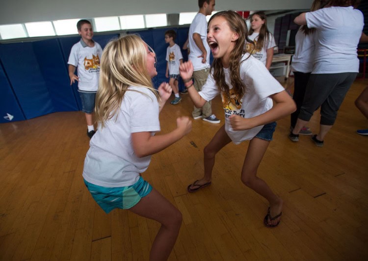 Erin Alburger, 11, (right) acts as part of an exercise in the "Clowning" class during Randolph's WildCat Theatre Conservatory in Lynchburg on Monday. (Photo by Autumn Parry)