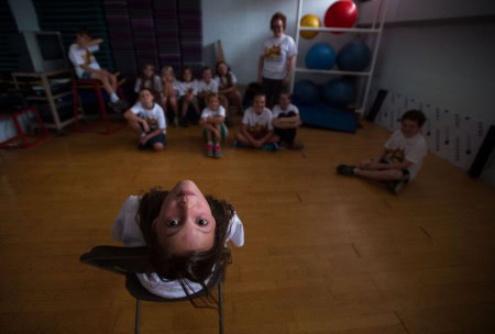 Erin Alburger, 11, participates in a staring exercise as the students learn how to become clowns during Randolph's WildCat Theatre Conservatory in Lynchburg on Monday. (Photo by Autumn Parry)