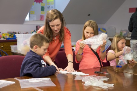 Grace Cummins '16 teaches TAG students about polymers.