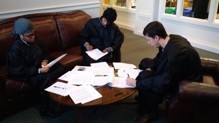 The judges study all the evidence before issuing their final ruling.