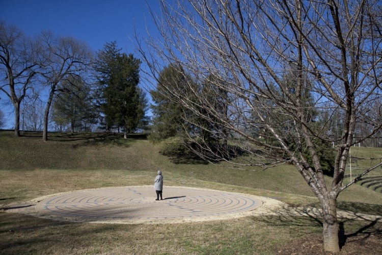 Alice Hilseweck Ball ’61 takes a moment to reflect in the center of the labyrinth.