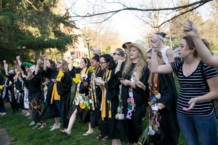 Students sing and dance during the traditional serenade at the Sundial.