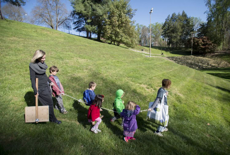 Students and teachers walk through Randolph College's campus on Wednesday to the organic garden. Photo by Jill Nance