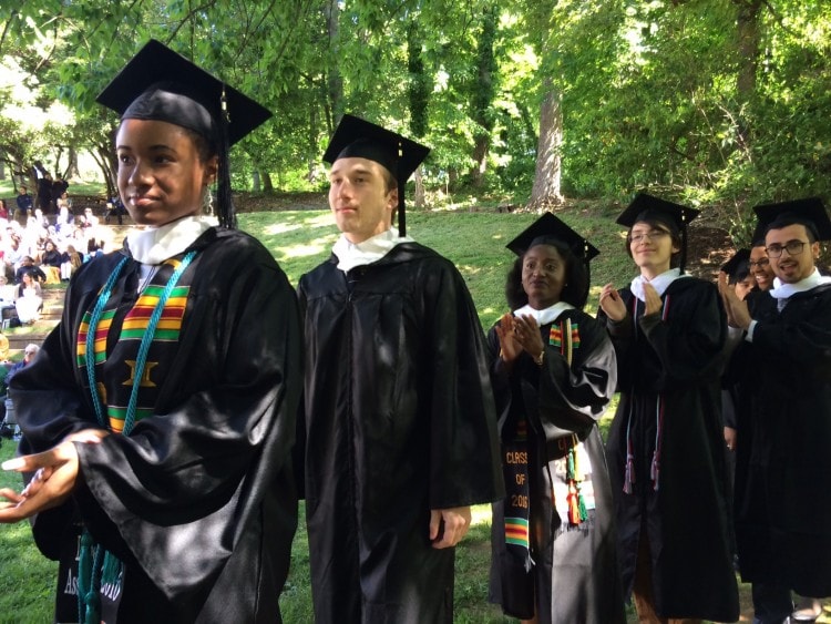 Graduates process into the Dell