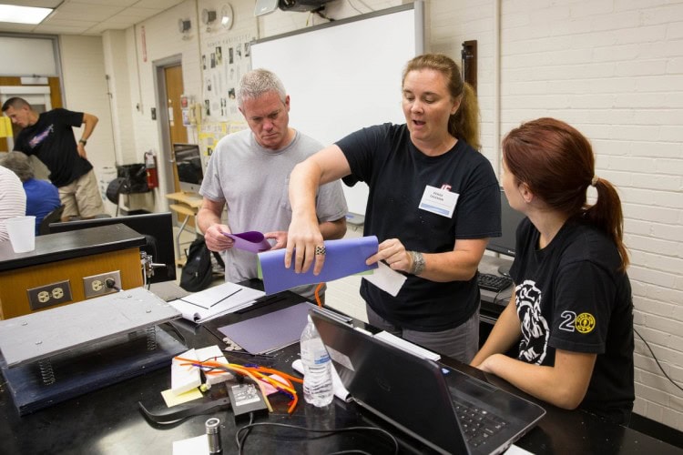 Participants in Randolph's teaching institute work together to build a structure that would be tested on the shake table. Participants in Randolph's teaching institute work together to build a structure that would be tested on the shake table.