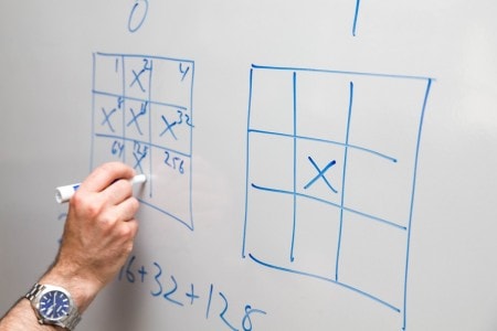 Mathematics professor Marc Ordower demonstrates the strategy of the game.