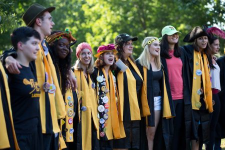 Students sing following the ceremony.