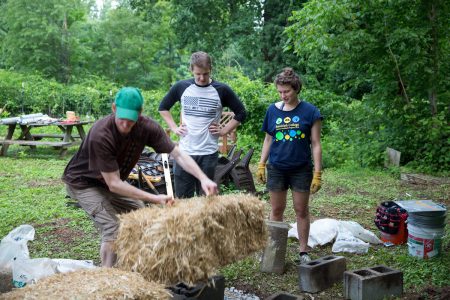 Randolph students are highly involved in the College's sustainable practices. Pictured is a workshop on strawbale construction led by Jessy Spencer '17 this summer.