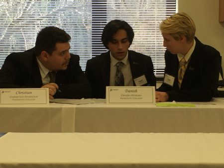 (From left) Christian Ridenour '18, Danish Roshan '18, and Katya Schwab '17 deliberate during the 2017 VFIC Ethics Bowl.