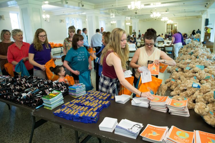 Volunteers assemble after-care kits in Smith Banquet Hall