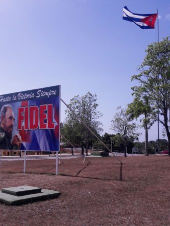 Cuban flag and Fidel Castro billboard