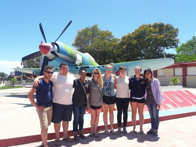 Randolph students in front of a classic Cuban airplane.