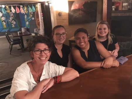 (From left) Maier education curator Laura McManus, office manager and public engagement coordinator Danni Schreffler, Stacey Samuels '18, and Maddie Shelby '18