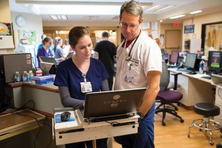 Sara Reed '15 works with a doctor at Centra Lynchburg General Hospital.