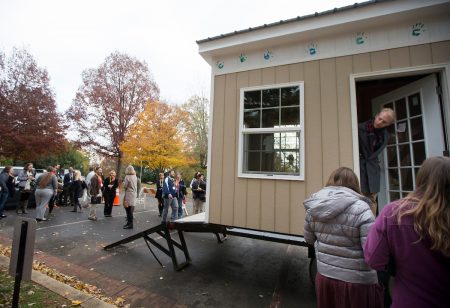 Participants at the 2017 Heick Symposium on Education tour a tiny house built by Randolph students and students at P.L. Dunbar Middle School.