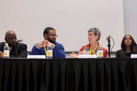 Karen Campbell '77 (right) speaks to Derrick Brown during a panel discussion on preparing students for future success.