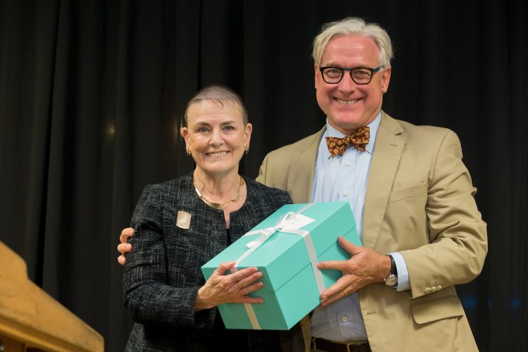 Carla Alexander '68 accepts her Alumnae Achievement Award from President Bradley W. Bateman. Carla Alexander '68 accepts her Alumnae Achievement Award from President Bradley W. Bateman.