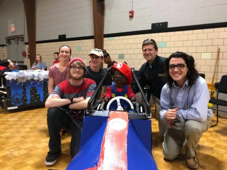 (Left to right) Jessica Gross '21, Brendan Wicker '21, Brendan Kaiser '21, Charli, Peter Sheldon, physics professor, and Joe Vazquez '19