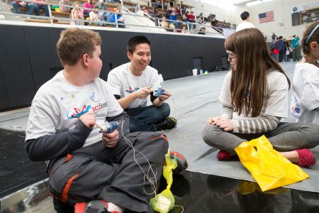 The annual Science Festival is one of the Randolph Society of Physics Students' biggest events. Here, a Randolph student shows children how to create a circuit.