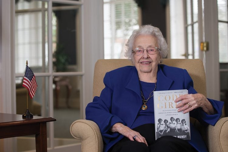 Dorothy Braden Bruce ‘42 holds a copy of the recently released book that details her previously top secret experiences as a WWII codebreaker for the U.S. Army.