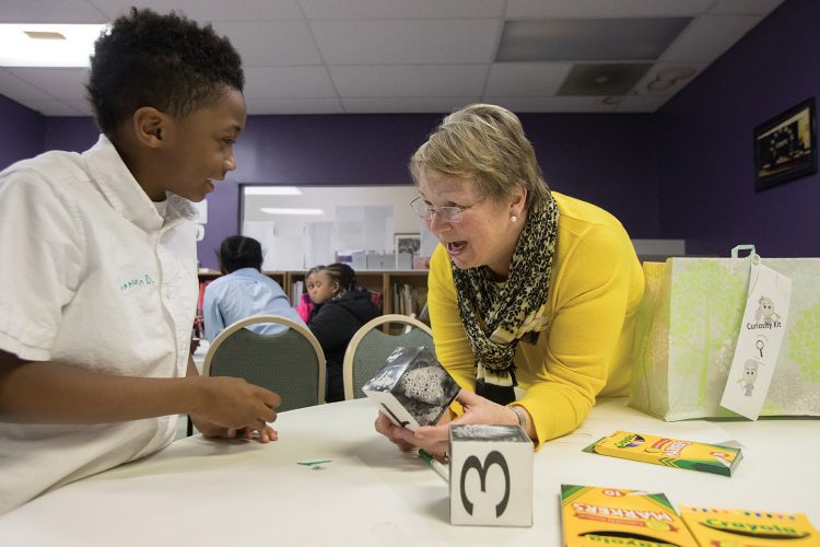 Cheryl Lindeman works with a Curiosity Club student at the Jubilee Family Development Center.