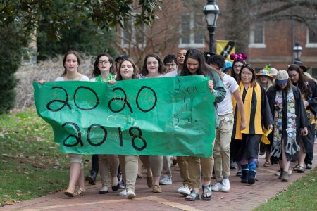 Sophomores carry the banner and lead the procession to the Sundial