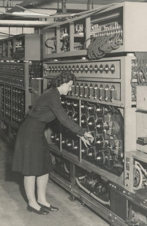 A code breaker operates a bombe, which is an early computer that performed mathematical operations necessary to read enemy message traffic. (Photo courtesy of National Security Agency) mathematical operations necessary to read enemy message traffic. (Photo courtesy of National Security Agency)