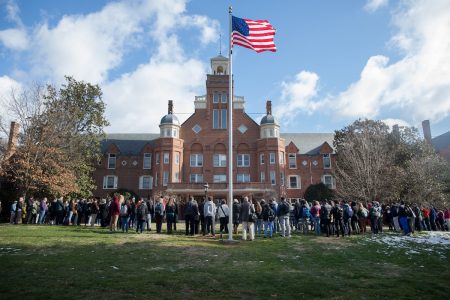 A large group of people gathered in front of Main Hall in observance of the national walkout protesting gun violence on March 14.