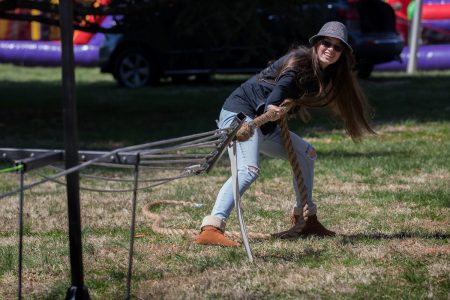 Student participates in a tug of war contest at Randolph College's Science Festival