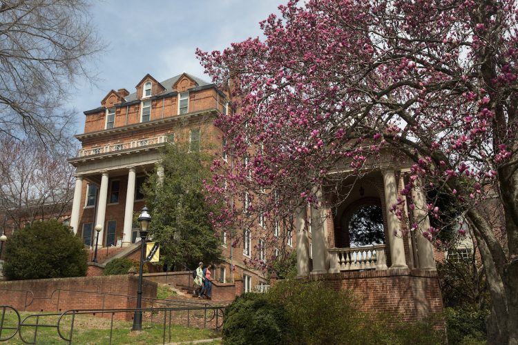 Spring flowers in front of the Engagement Tower and Moore Hall. Spring flowers in front of the Engagement Tower and Moore Hall.
