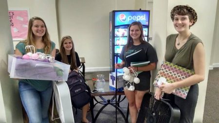 Students with some of their "new" items from the Rummage Room at the beginning of the 2017-18 academic year