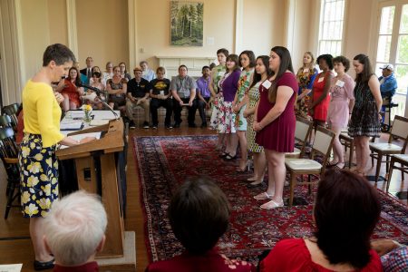 Phi Beta Kappa inductees stand as they are recognized as Phi Beta Kappa inductees