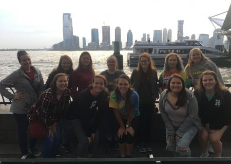 Randolph students on the ferry to Ellis Island in New York City, with skyscrapers in the background