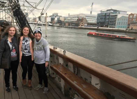 Students touring a coffin ship used to take immigrants to America