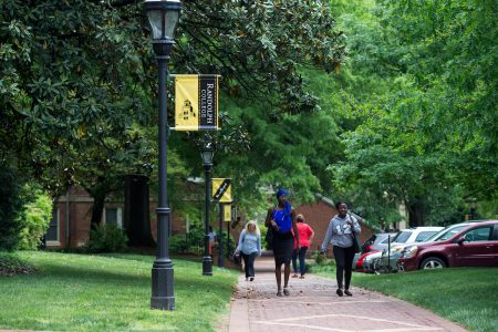 Students walking along the brick path on front campus