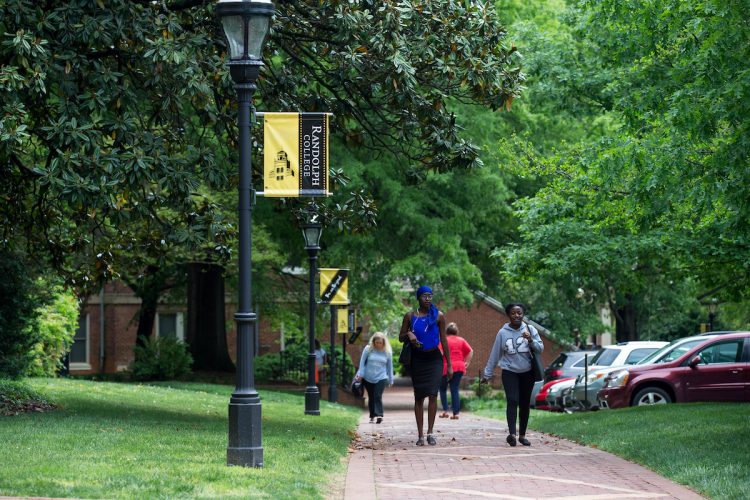 Students walking along the brick path on front campus Students walking along the brick path on front campus