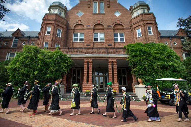 Students carry the Daisy Chain past Main Hall Students carry the Daisy Chain past Main Hall