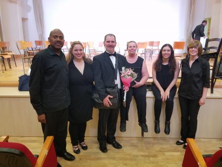 Music professor Randall Speer and students following a performance